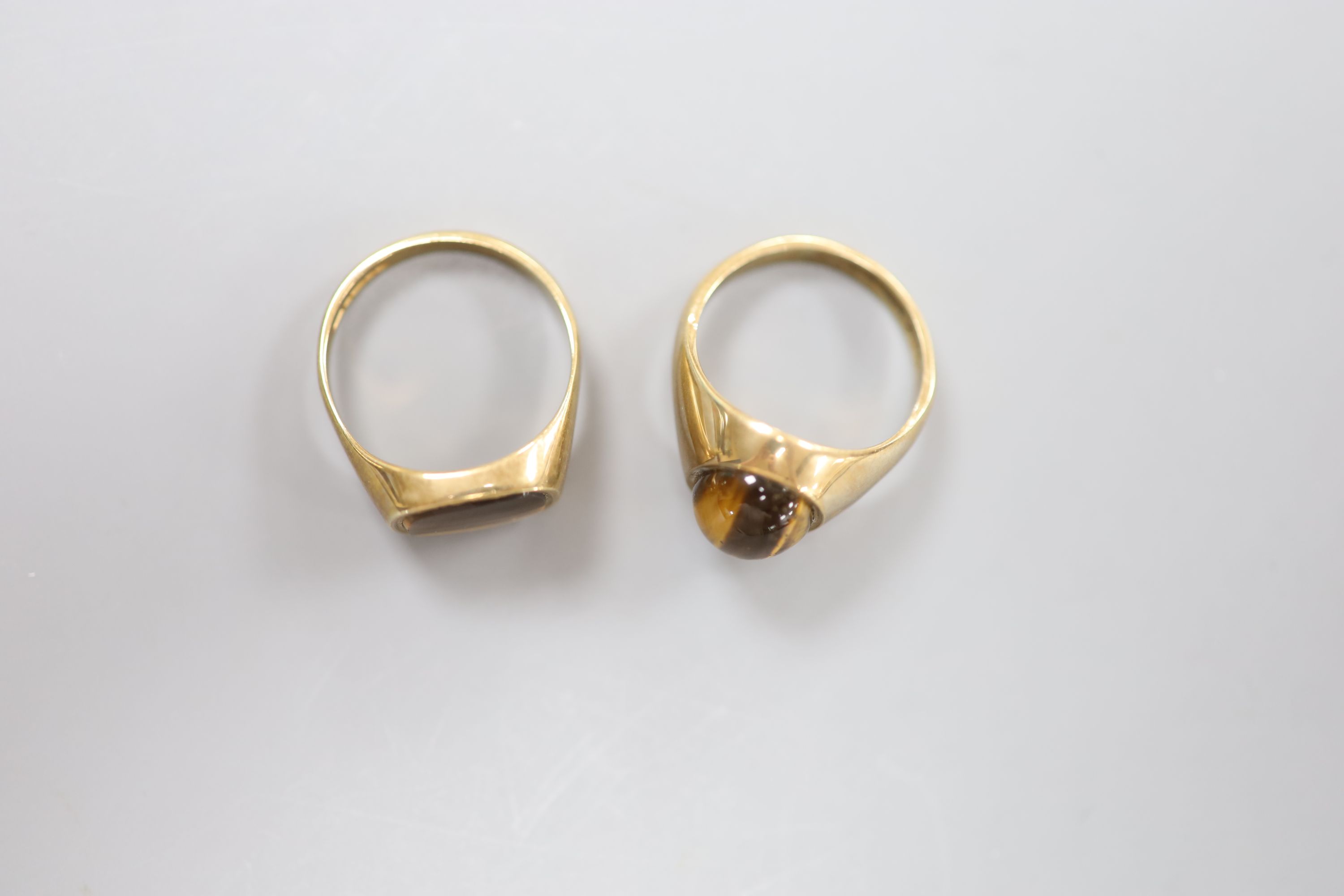 Two modern 9ct gold and tiger's eye quartz set signet rings, sizes S & U/V